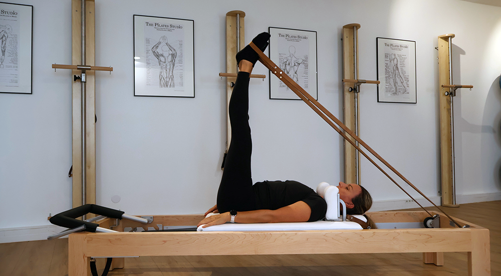 exercice de pilates sur reformer